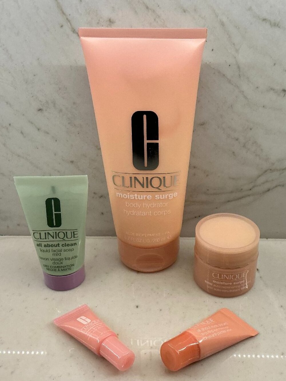 NWT Clinique Full Size and Four Travel Sizes - "Moisture Surge" and "All About"